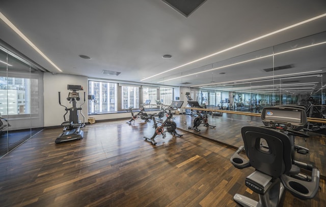 75 Wall St Unit 26A, New York City, NY 10005 - workout area with wood finished floors and baseboards