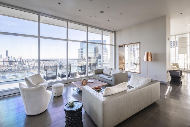 living area featuring a city view and a wall of windows