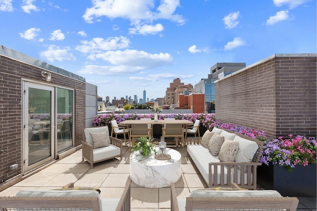 view of patio featuring a view of city and an outdoor hangout area