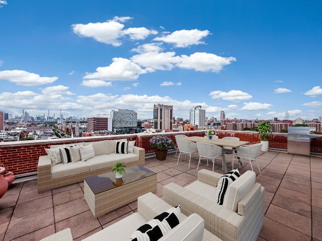 view of patio featuring a grill, a city view, and outdoor lounge area