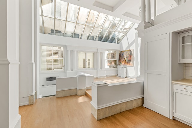 31 Greene St Unit 1, New York City, NY 10013 - kitchen with light wood finished floors, white cabinets, and light countertops