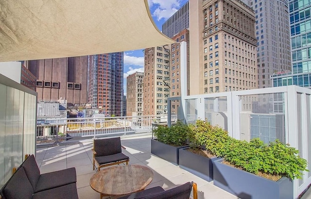 view of patio / terrace featuring a view of city