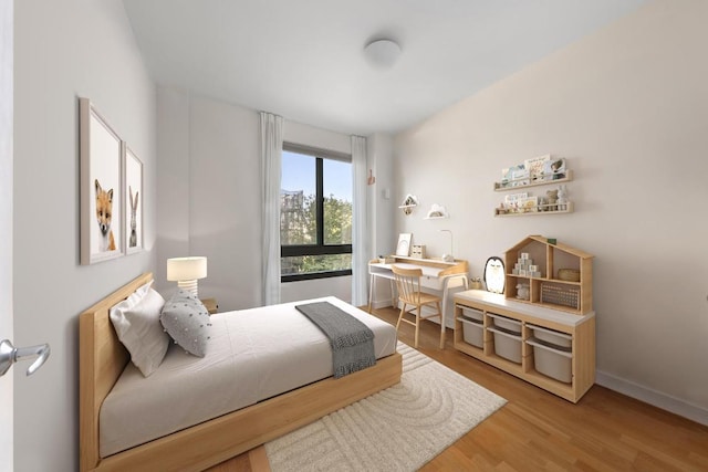 bedroom featuring hardwood / wood-style flooring