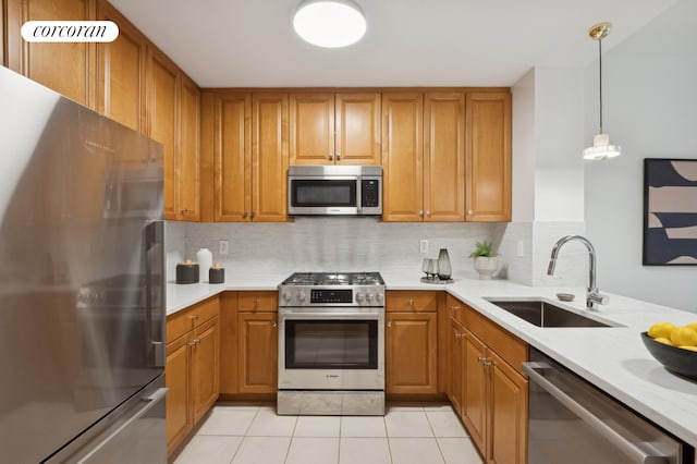 425 Main St Unit 14A, New York City, NY 10044 - kitchen with appliances with stainless steel finishes, light countertops, brown cabinetry, and tasteful backsplash
