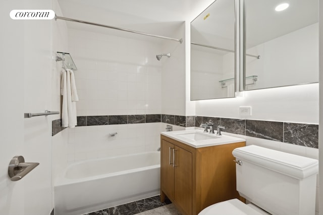 425 Main St Unit 14A, New York City, NY 10044 - full bathroom featuring vanity, shower / washtub combination, tile walls, and recessed lighting