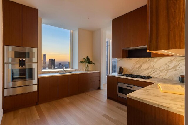 exercise room with expansive windows, a wealth of natural light, and wooden ceiling