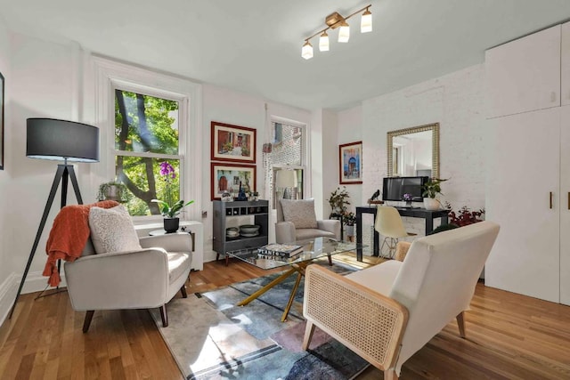 sitting room featuring light hardwood / wood-style floors