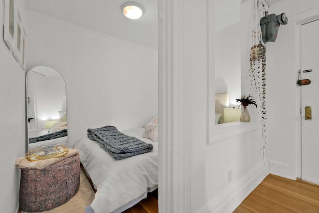 bedroom with wood-type flooring