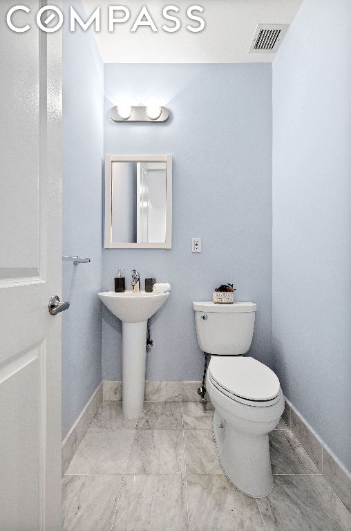 bathroom featuring sink and toilet