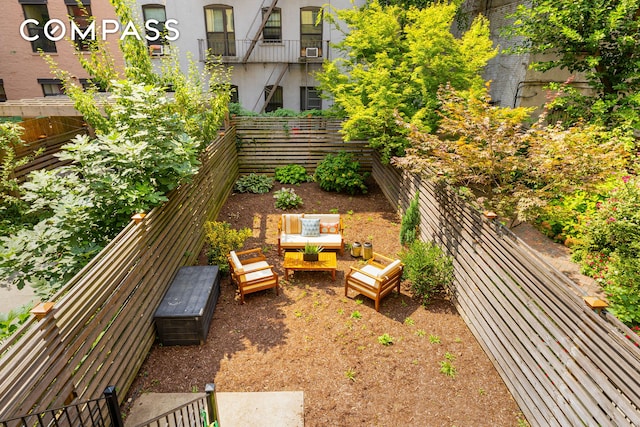 view of yard featuring cooling unit and fence