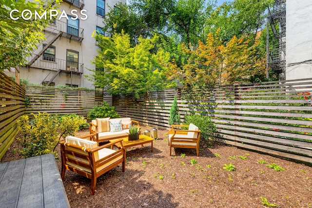 view of patio with a fenced backyard and outdoor lounge area