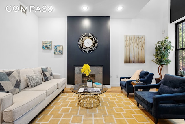 160 W 128th St, New York City, NY 10027 - living room with wood finished floors, recessed lighting, baseboards, and a fireplace