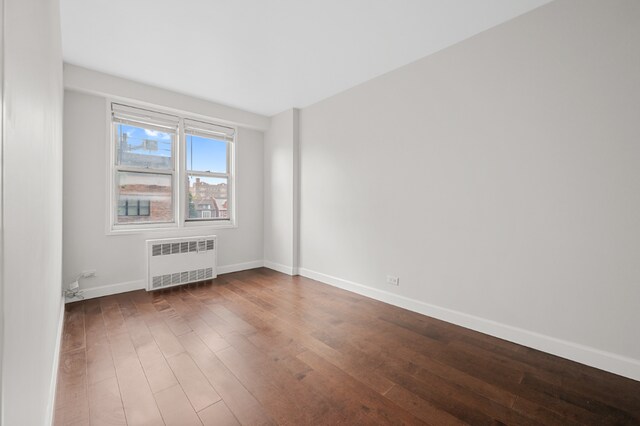 living room with dark hardwood / wood-style floors