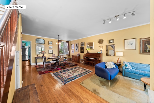 bedroom with cooling unit, hardwood / wood-style floors, and ceiling fan