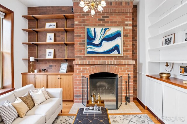 146 W 82nd St Unit 3A, New York City, NY 10024 - living area featuring light wood-style floors and a fireplace