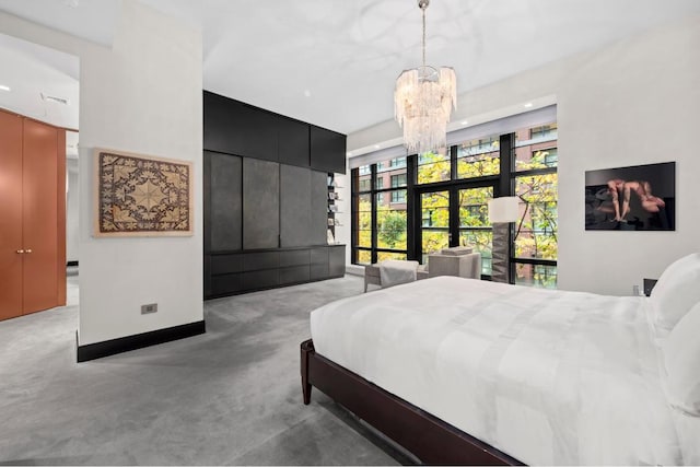 carpeted bedroom featuring a chandelier