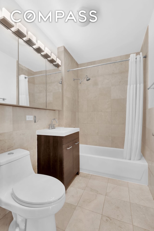 bathroom featuring vanity, tile walls, toilet, and shower / tub combo with curtain