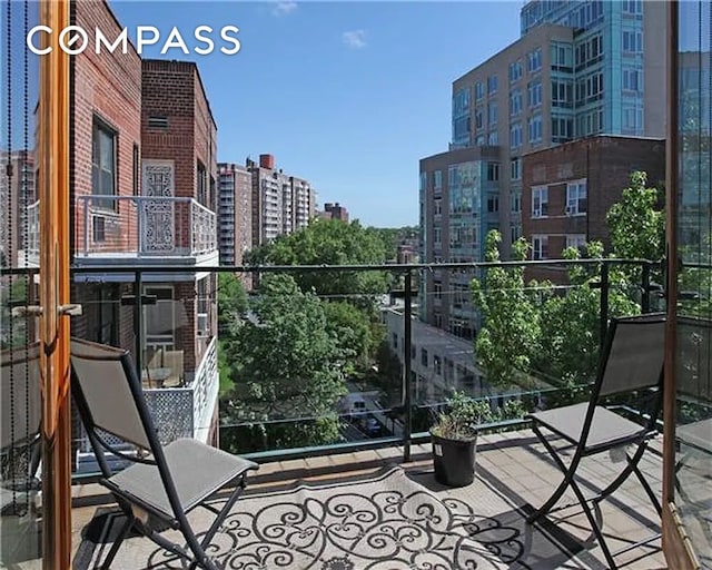 balcony featuring a city view