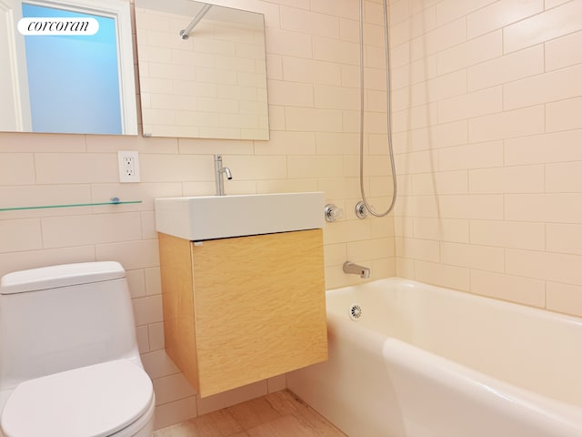 full bath with vanity, shower / bathing tub combination, and toilet