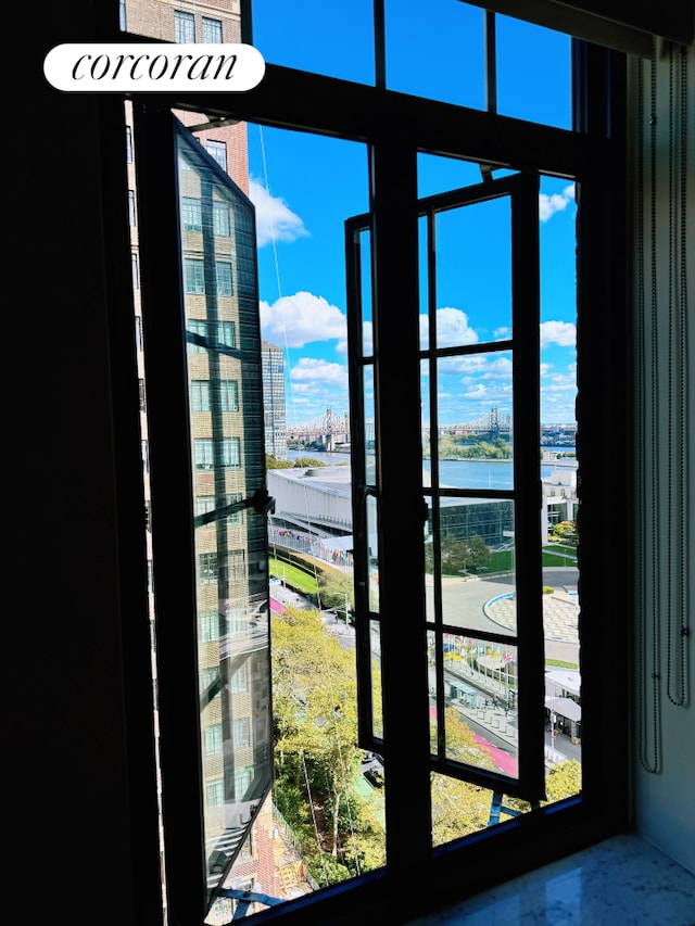 room details featuring a water view and a city view