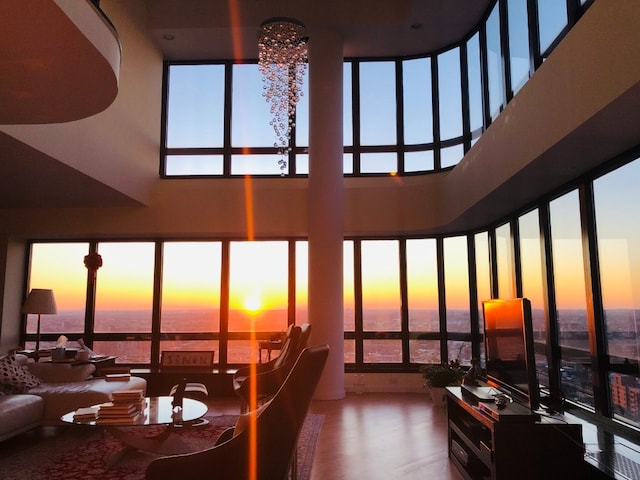 living room featuring a towering ceiling