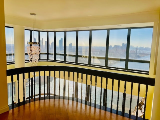 unfurnished sunroom featuring a water view