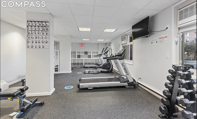 gym featuring a paneled ceiling