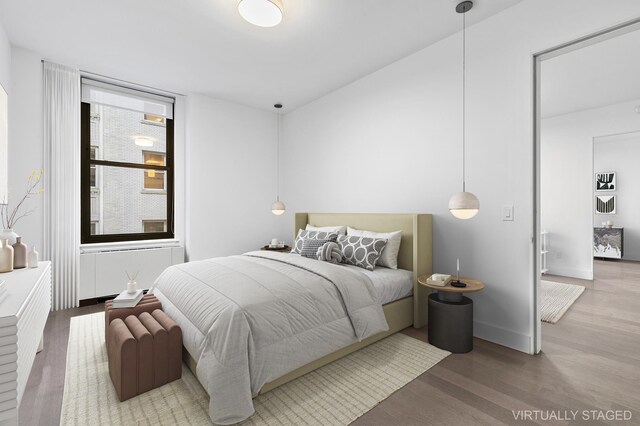 bedroom featuring wood finished floors