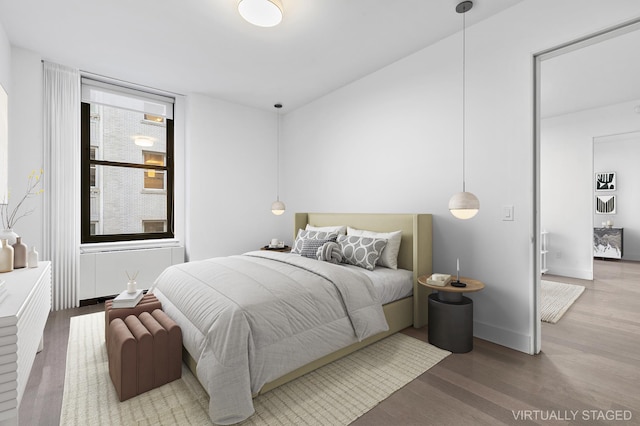 bedroom with wood finished floors