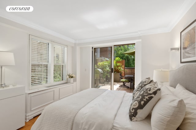 bedroom featuring light wood-type flooring, ornamental molding, access to outside, and multiple windows