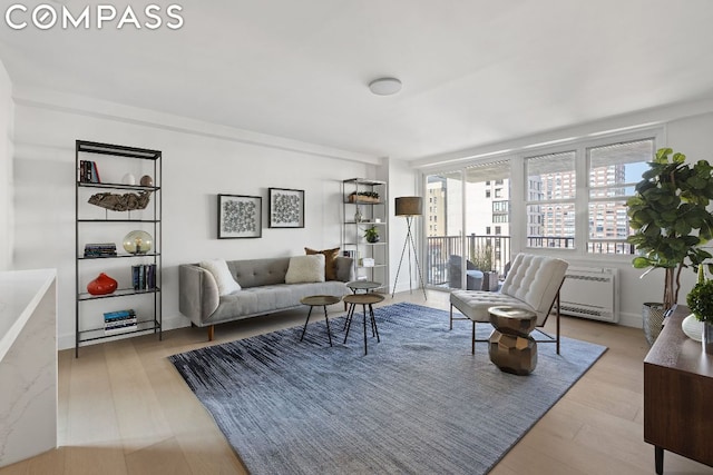 living room with light hardwood / wood-style flooring