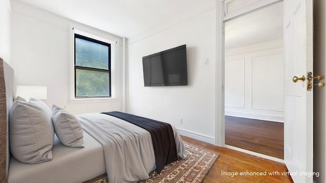 bedroom featuring wood-type flooring