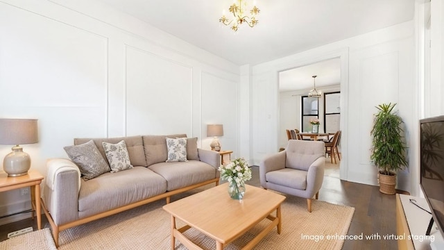 living room with hardwood / wood-style flooring and a notable chandelier