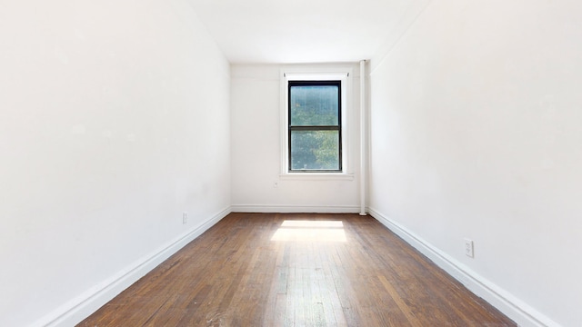 empty room featuring dark hardwood / wood-style floors