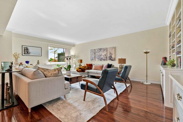 living room with dark hardwood / wood-style flooring and ornamental molding