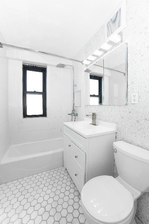 full bathroom with vanity, toilet, and shower / bathing tub combination