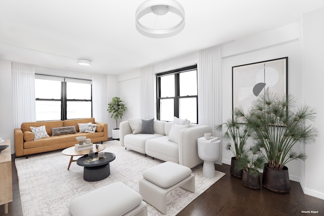 living area featuring plenty of natural light and baseboards