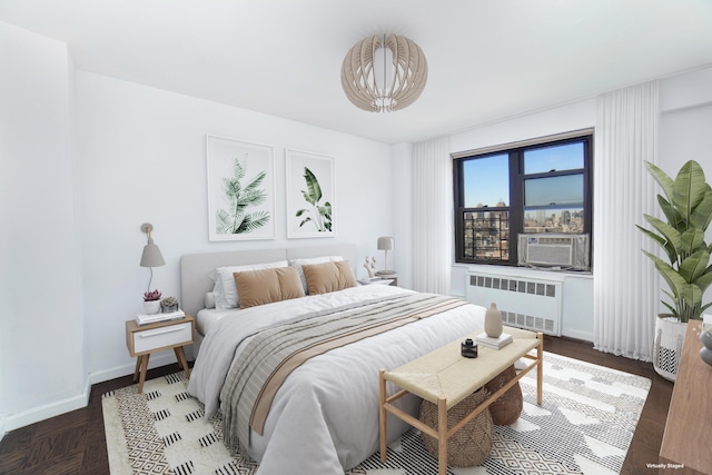 210 E Broadway Unit H1904, New York City, NY 10002 - bedroom featuring radiator heating unit, cooling unit, and baseboards