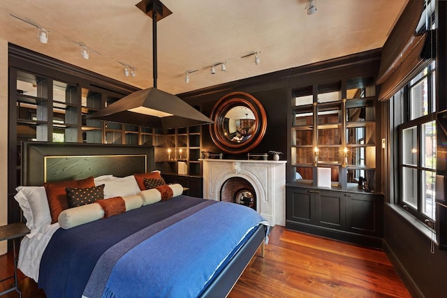 bedroom with wood-type flooring