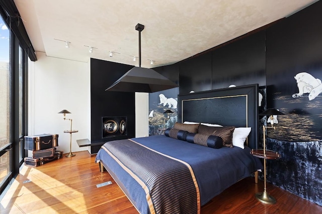 bedroom with wood-type flooring