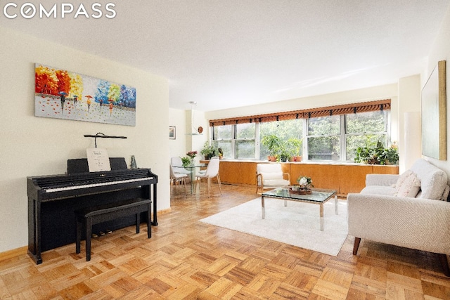 living room with a wealth of natural light and light parquet floors