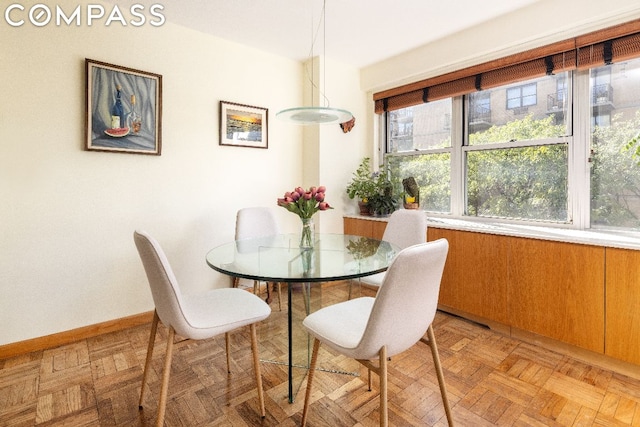 dining area with light parquet flooring