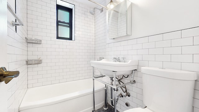 full bathroom with toilet, bathtub / shower combination, and tile walls