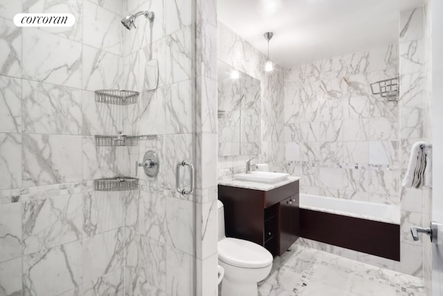 bathroom with vanity, tile walls, and toilet