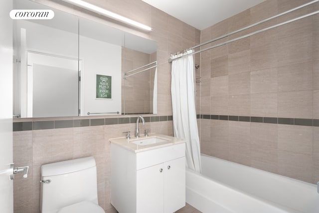 full bath with tile walls, shower / bath combination with curtain, visible vents, toilet, and vanity