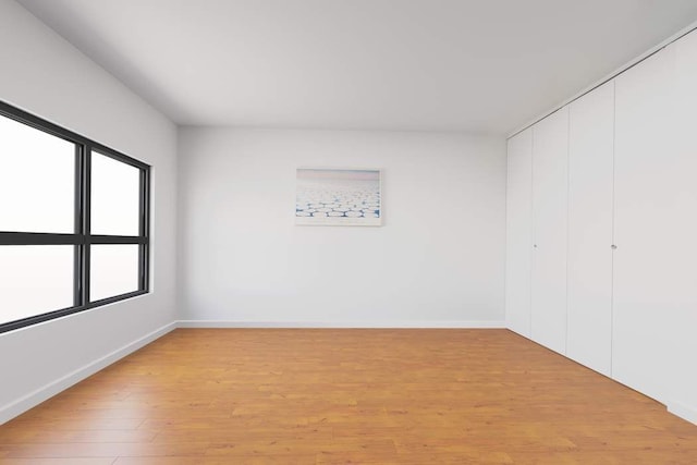 empty room with light hardwood / wood-style floors