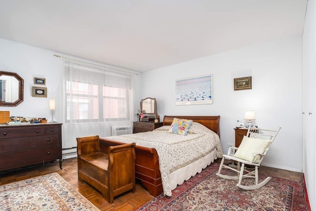 bedroom with parquet floors, a wall unit AC, and baseboard heating