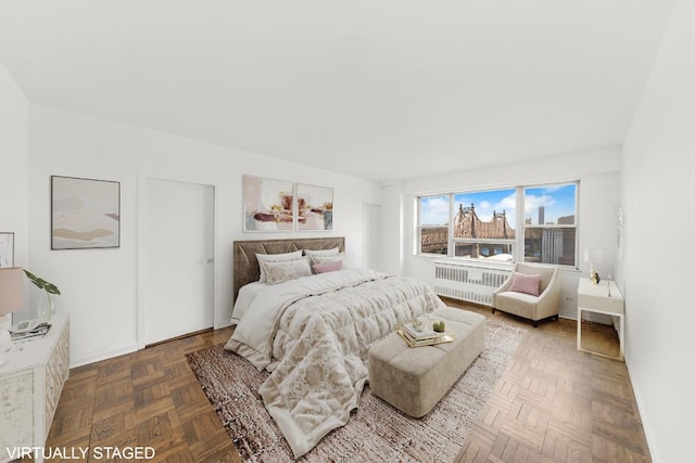 bedroom with radiator and parquet flooring