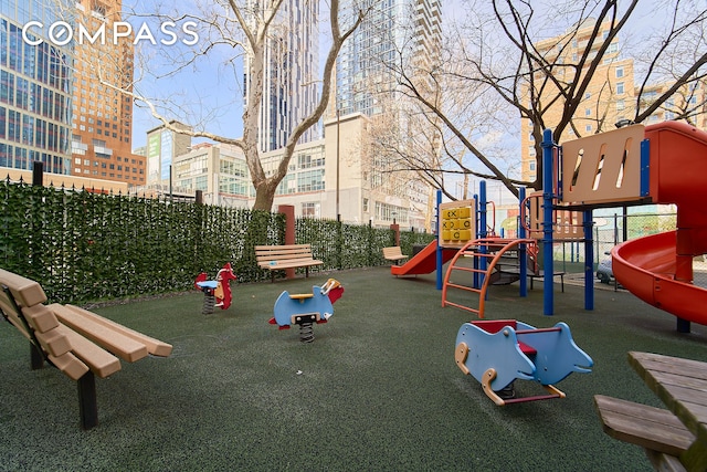 communal playground featuring fence