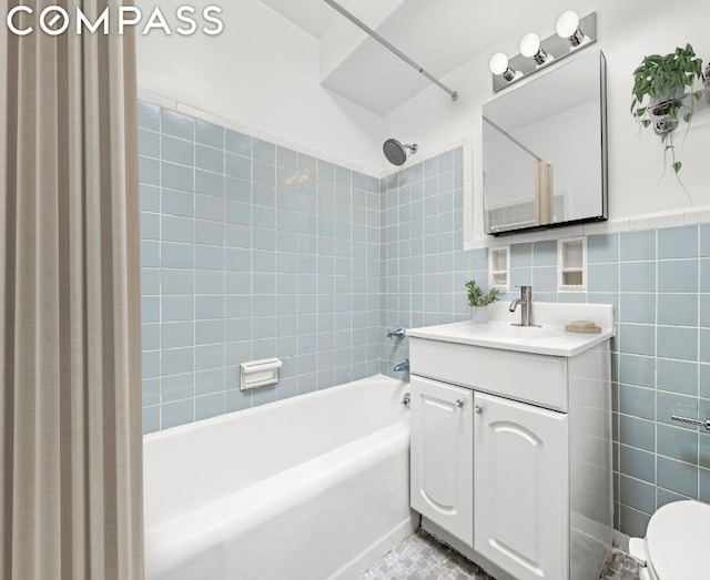 kitchen featuring white appliances, white cabinets, radiator heating unit, sink, and light hardwood / wood-style flooring